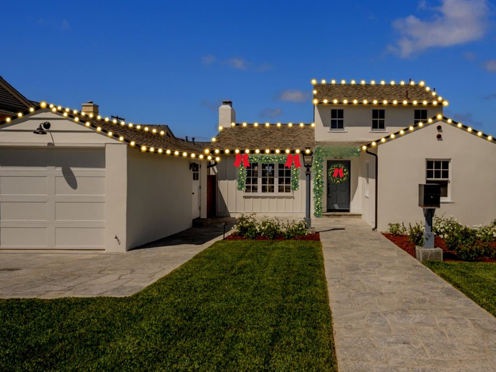 Design preview of a white La Jolla cottage with warm white C9 bulbs on every roofline, garland with red bows over the front window, and a wreath on the blue door